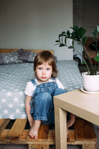 Portrait child preschooler at home. looking seriously into the camera