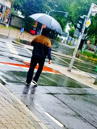 Blurred motion of man walking on road