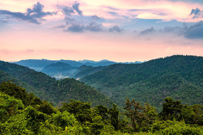 Scenic view of mountains against sky at sunset