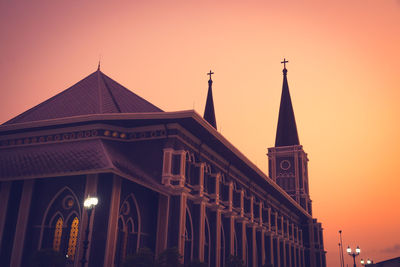 Low angle view of building against sky during sunset