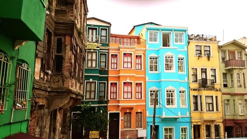 Houses against sky in city