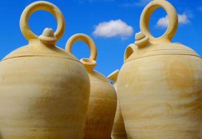 Low angle view of pastries against blue sky