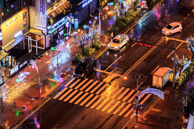 High angle view of illuminated city street at night