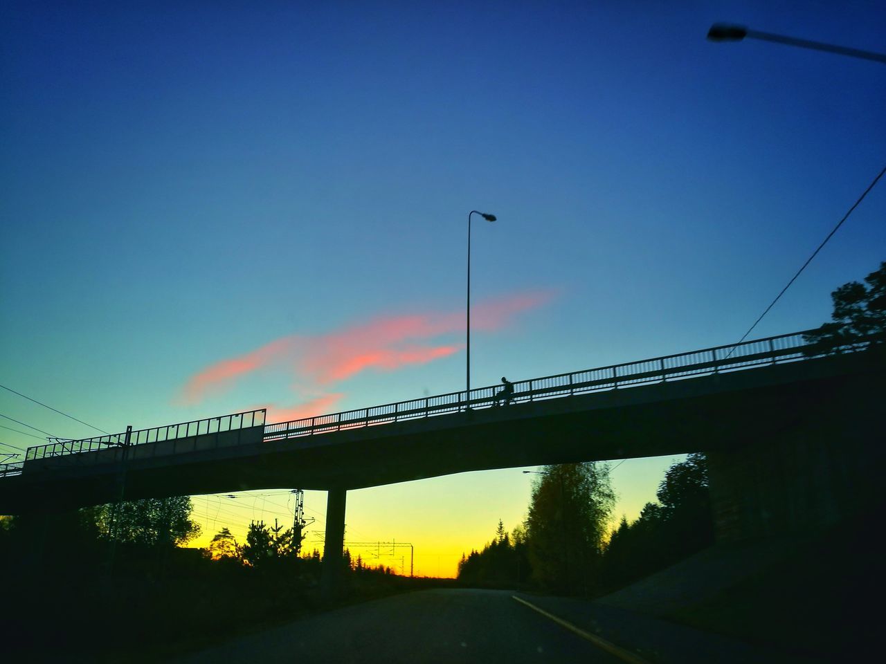 BRIDGE AGAINST BLUE SKY DURING SUNSET