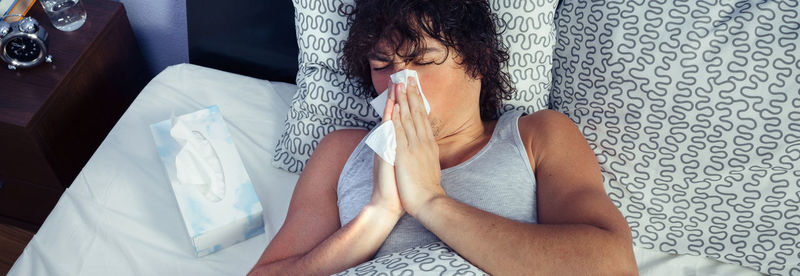 Midsection of woman sitting at home