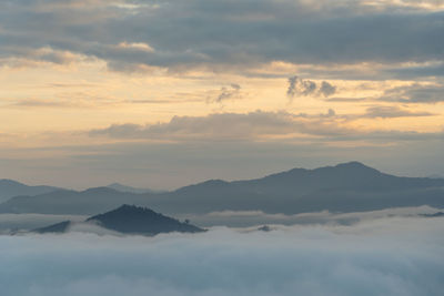 Scenic view of mountains against sky during sunset