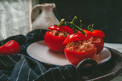 Close-up of red chili peppers in plate on table