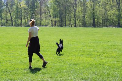 Rear view of woman on field