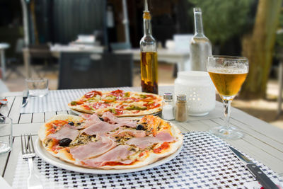 Pizza with ham and chorizo in a restaurant