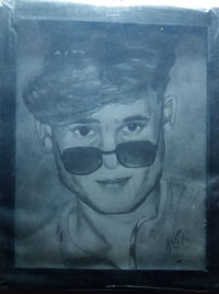 Close-up portrait of a boy wearing eyeglasses