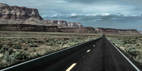 Country road leading towards mountains