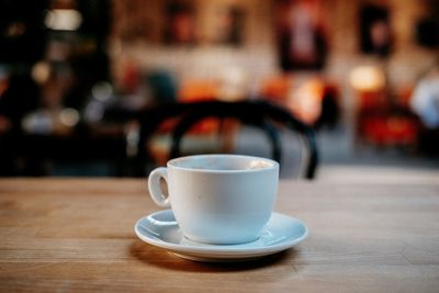 Close-up of coffee cup on table in cafe