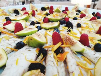 Close-up of chopped fruits on table