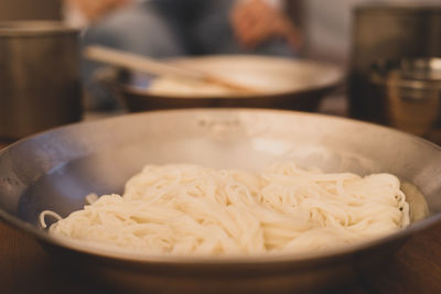 Close-up of noodles in bowl on table