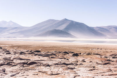 Scenic view of snowcapped mountains against clear sky