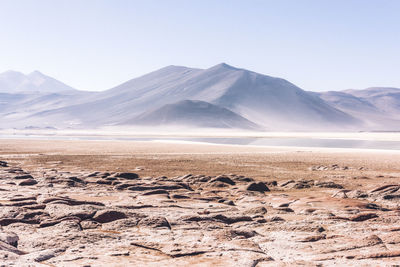 Scenic view of snowcapped mountains against clear sky