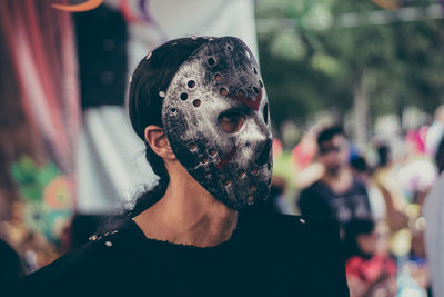 Close-up of young man wearing costume during carnival
