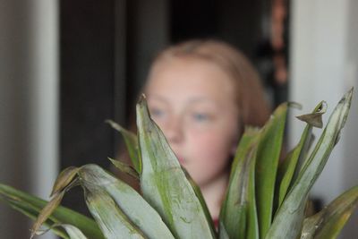 Close-up portrait of young woman looking away