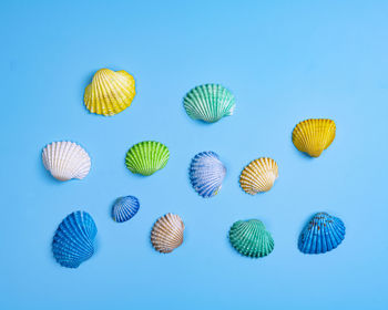 Low angle view of colorful balloons against clear blue background