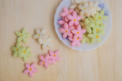 High angle view of multi colored candies on table