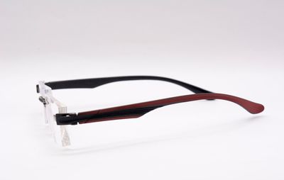 High angle view of umbrella on table against white background