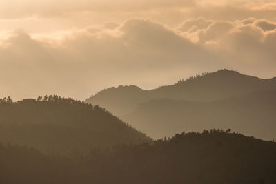 Scenic view of silhouette mountain against sky during sunset