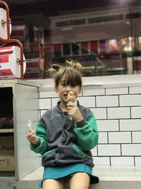 Portrait of boy holding food