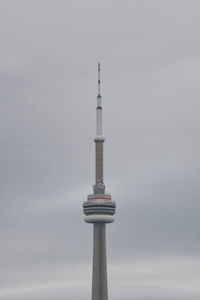 Low angle view of communications tower against sky