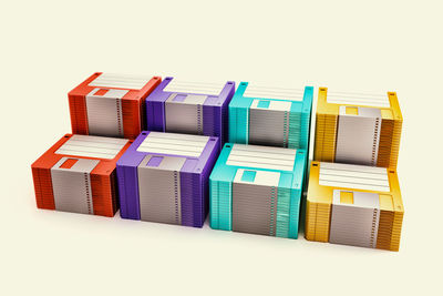 Stack of multi colored pencils against white background