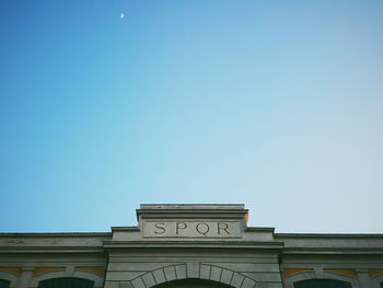 Low angle view of building against blue sky