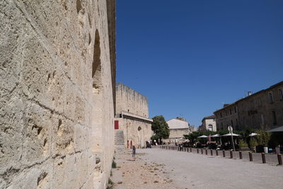 Built structures against clear blue sky