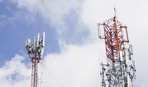 Low angle view of communications tower against sky