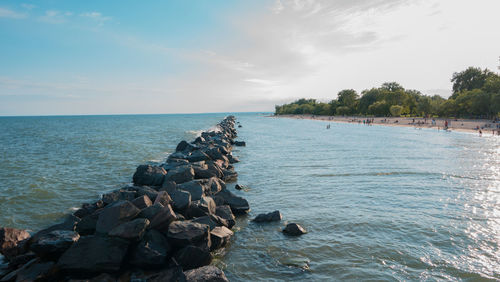 Scenic view of sea against cloudy sky