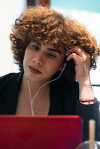 Portrait of young woman using mobile phone