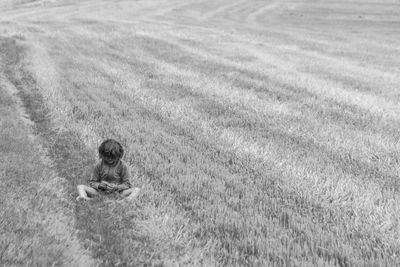 Little girl in a field sulking