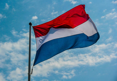 Low angle view of flag against sky