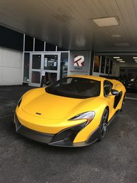 Yellow car in parking lot