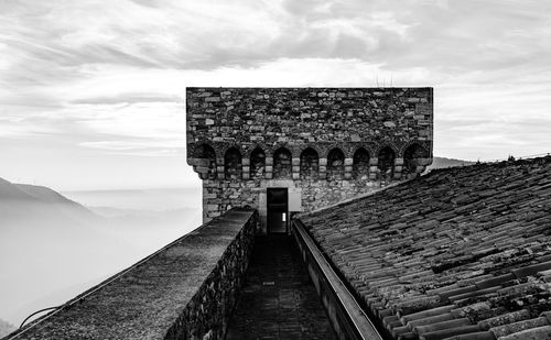 Historic building against cloudy sky