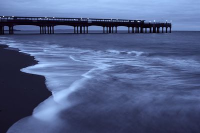 Pier over sea against sky