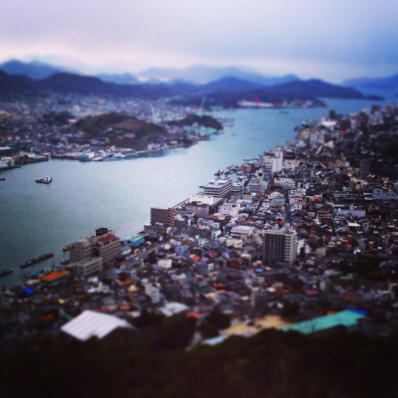 HIGH ANGLE VIEW OF CITY BUILDINGS AGAINST SKY