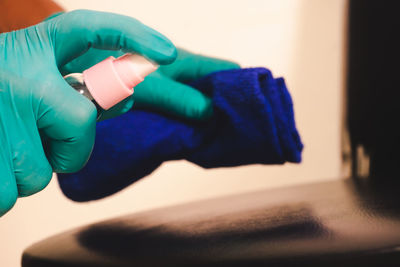 Close-up of hand holding umbrella