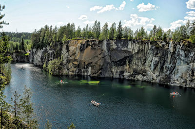 Scenic view of river against trees