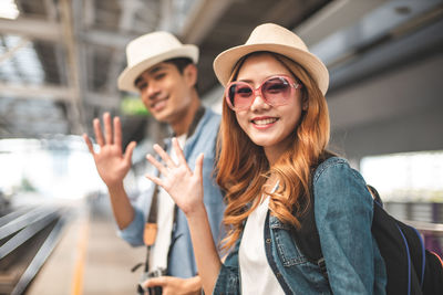 Portrait of smiling young man wearing sunglasses