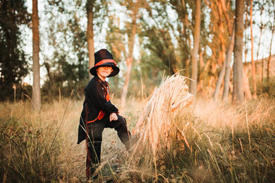 Boy wearing costume during halloween standing at forest