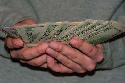 High angle view of hand holding paper