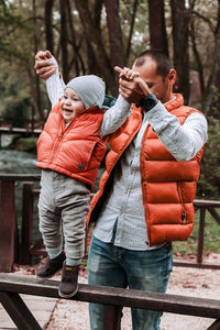 Holding you boy, dad and 1 year old son