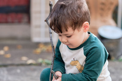 Cute little boy playing in the backyard