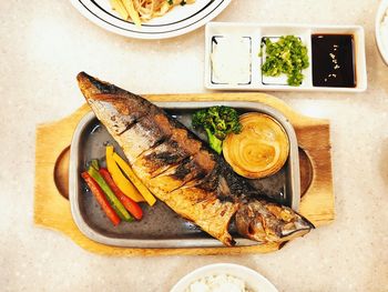 Close-up of fish served on table