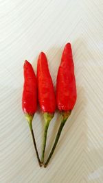 Close-up of red chili peppers on table