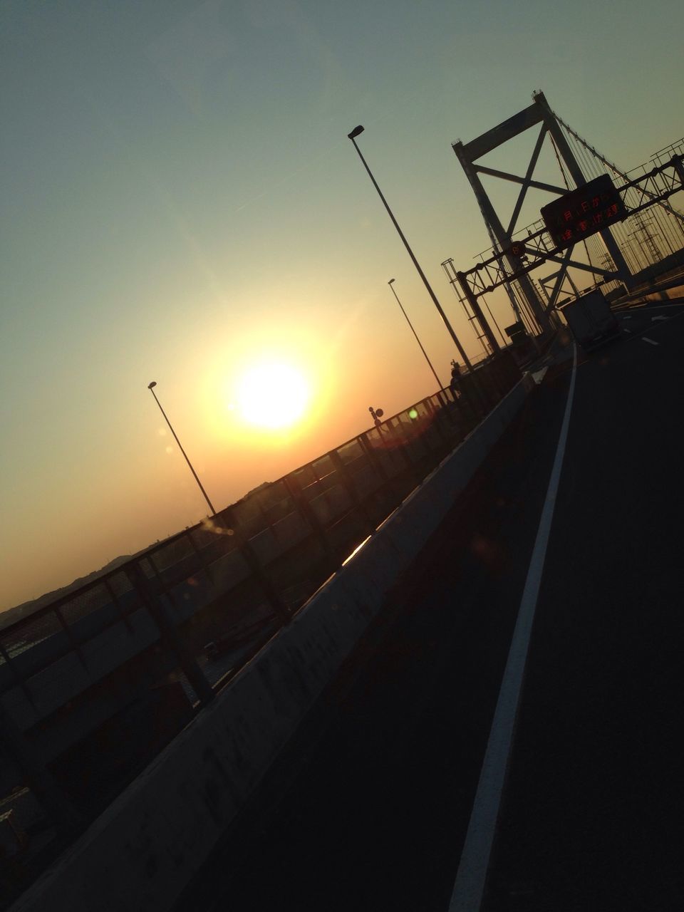 sunset, sun, sky, silhouette, sunlight, orange color, clear sky, transportation, sunbeam, lens flare, outdoors, no people, nature, mode of transport, built structure, railing, low angle view, beauty in nature, nautical vessel, metal